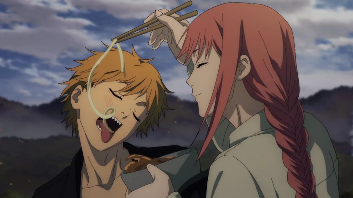A still from the Chainsaw Man anime showing Denji happily eating from a bowl held by Makima, illustrating her deceptive and manipulative nature as explored in fan theories.