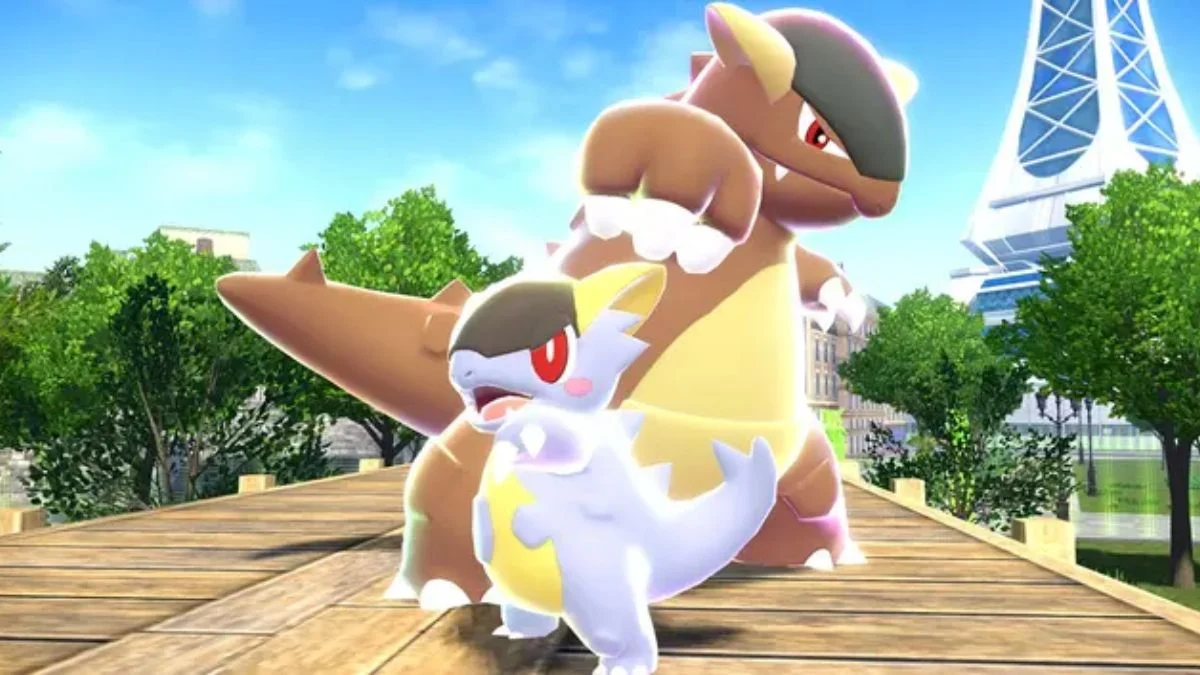 A Kangaskhan with its small, light-colored baby Pokémon standing on a wooden bridge, likely in Lumiose City, symbolizing parental bonds and the game's focus on existing Pokémon.