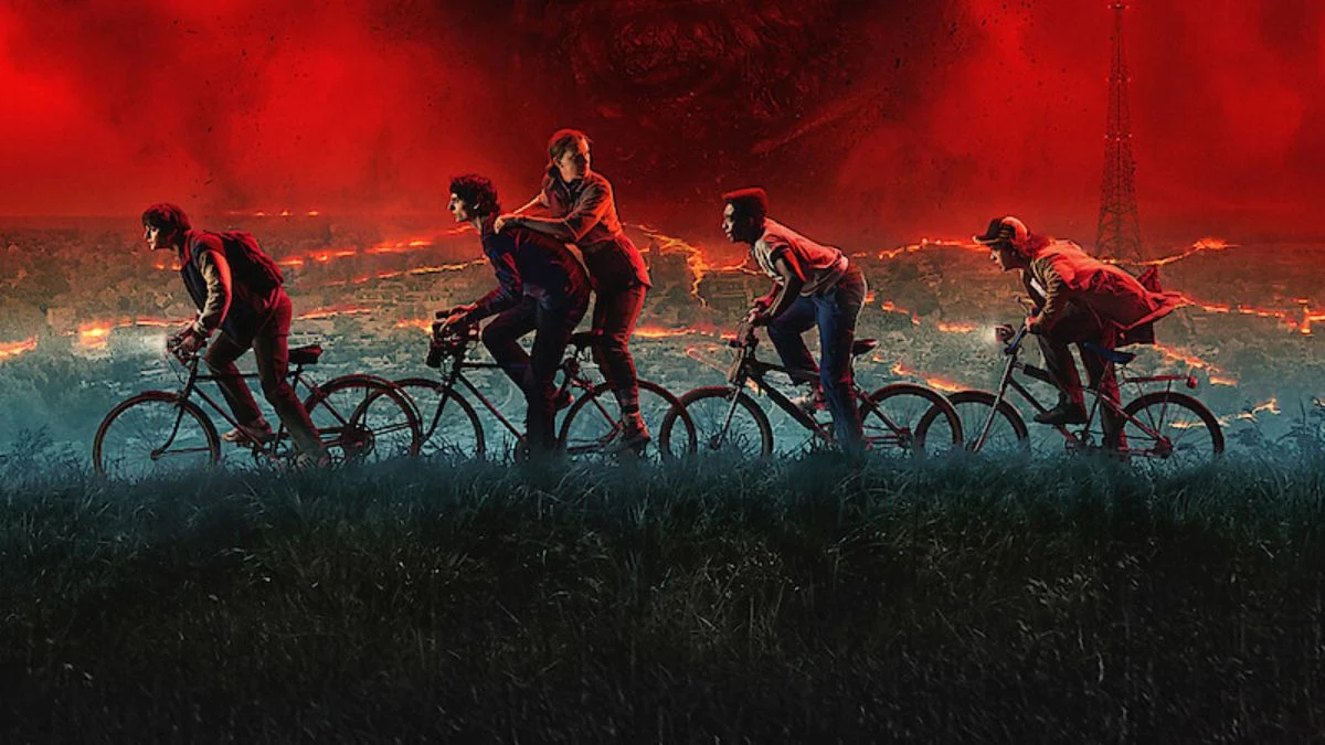 The main cast of Stranger Things Season 5 riding their bikes under a red sky corrupted by the Upside Down, symbolizing the final showdown between the two worlds in the series finale.