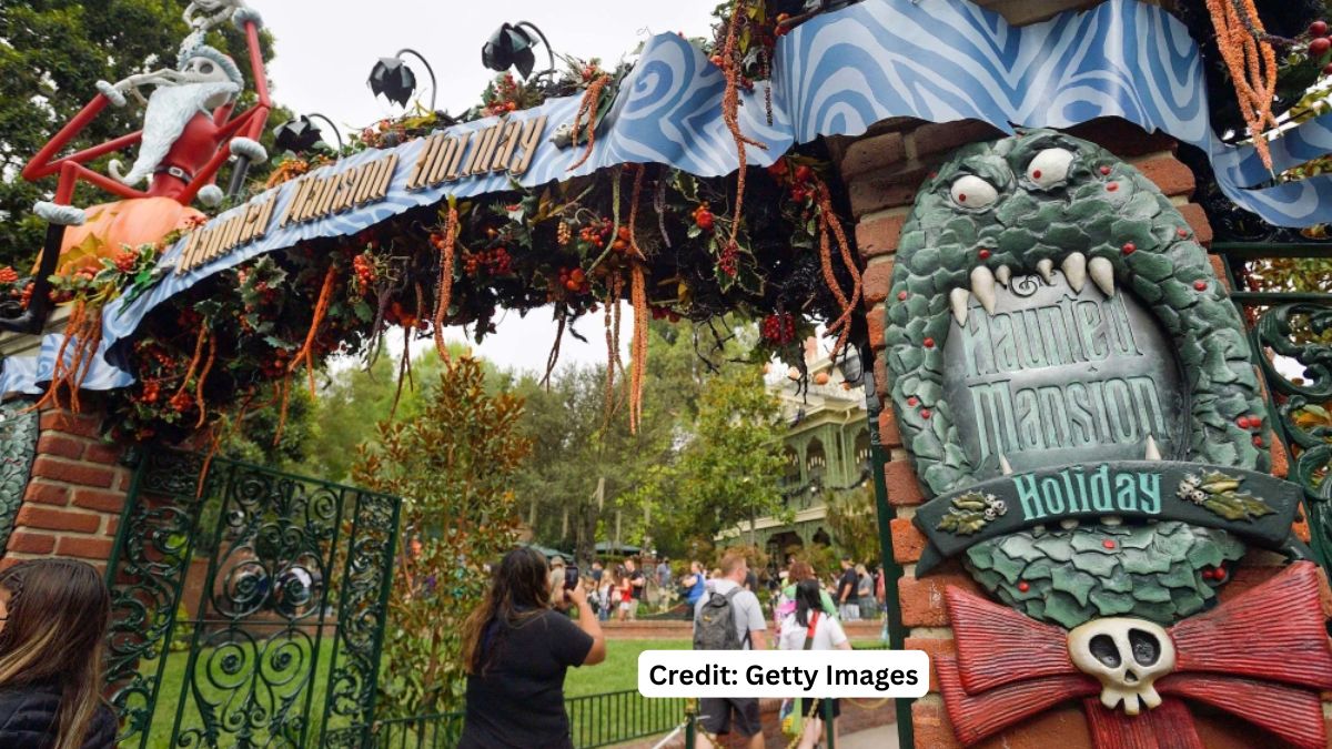Disneyland Haunted Mansion Holiday entrance gate with the monstrous Christmas wreath and Jack Skellington decorations, following a guest death.