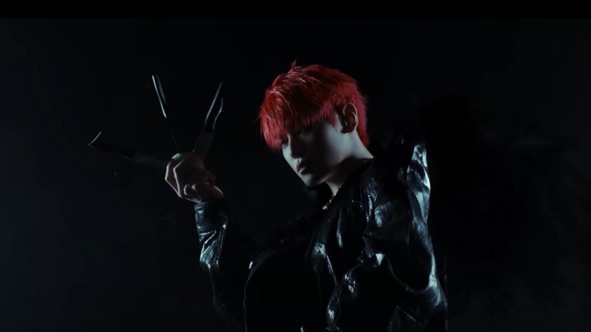 NCT’s Taeyong Drops Surprise Music Video for “501” — A Luminous Echo in Red and Green