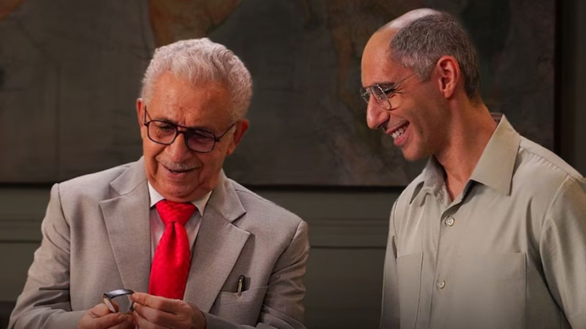 Naseeruddin Shah as J.R.D. Tata and Jim Sarbh as Xerxes Desai smiling while proudly examining an early Titan watch prototype.