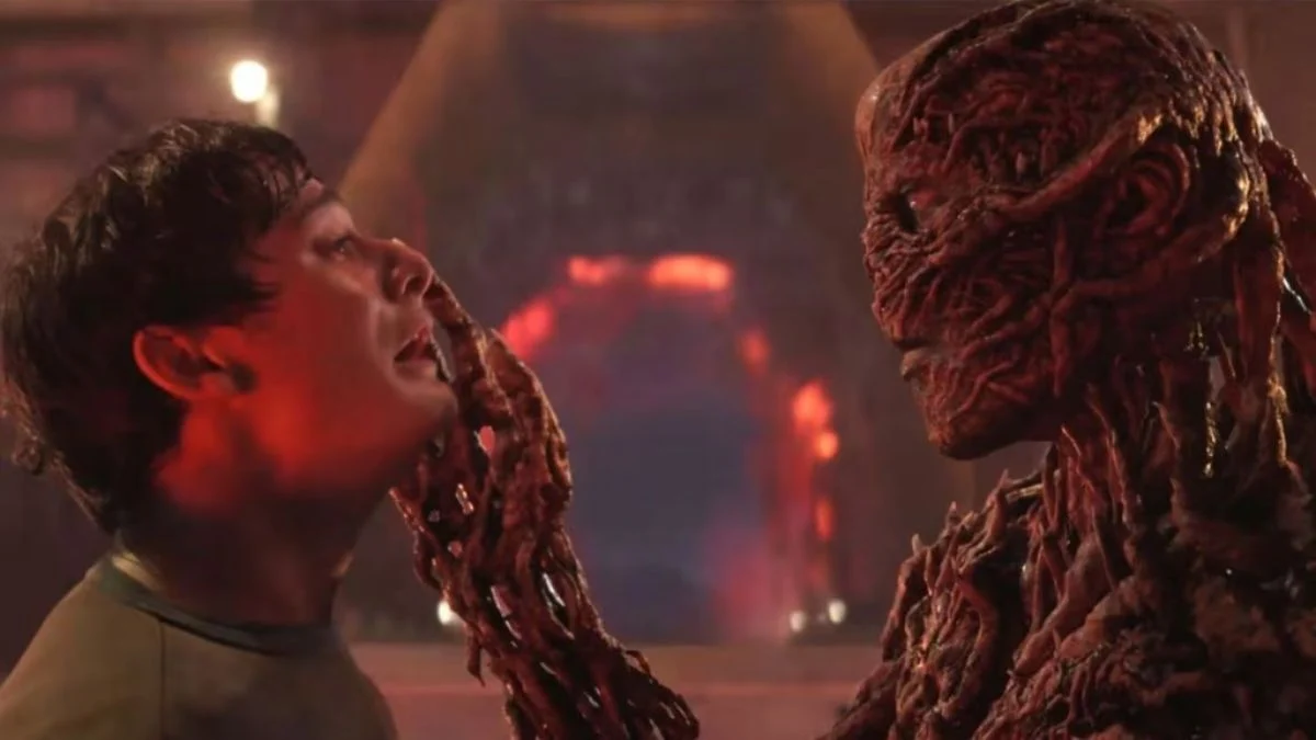 Vecna holding Will Byers by the face in the Upside Down in Stranger Things Season 4.