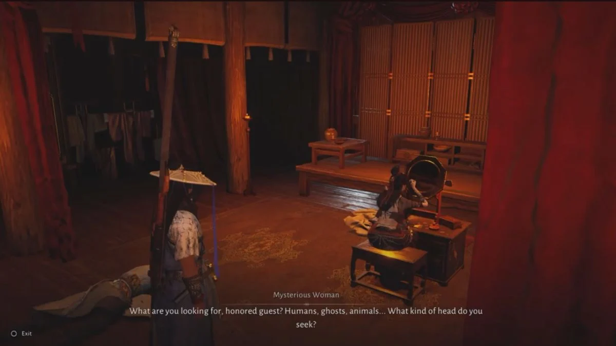 A mysterious woman sits at a vanity mirror inside the Ghost Revelry Hall in Where Winds Meet, speaking to the player character about different types of heads.