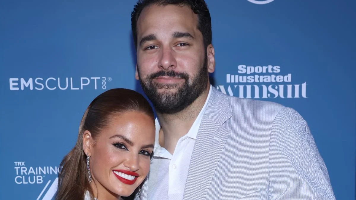 Matt Kalil and Haley Kalil smiling together at a Sports Illustrated red carpet event.