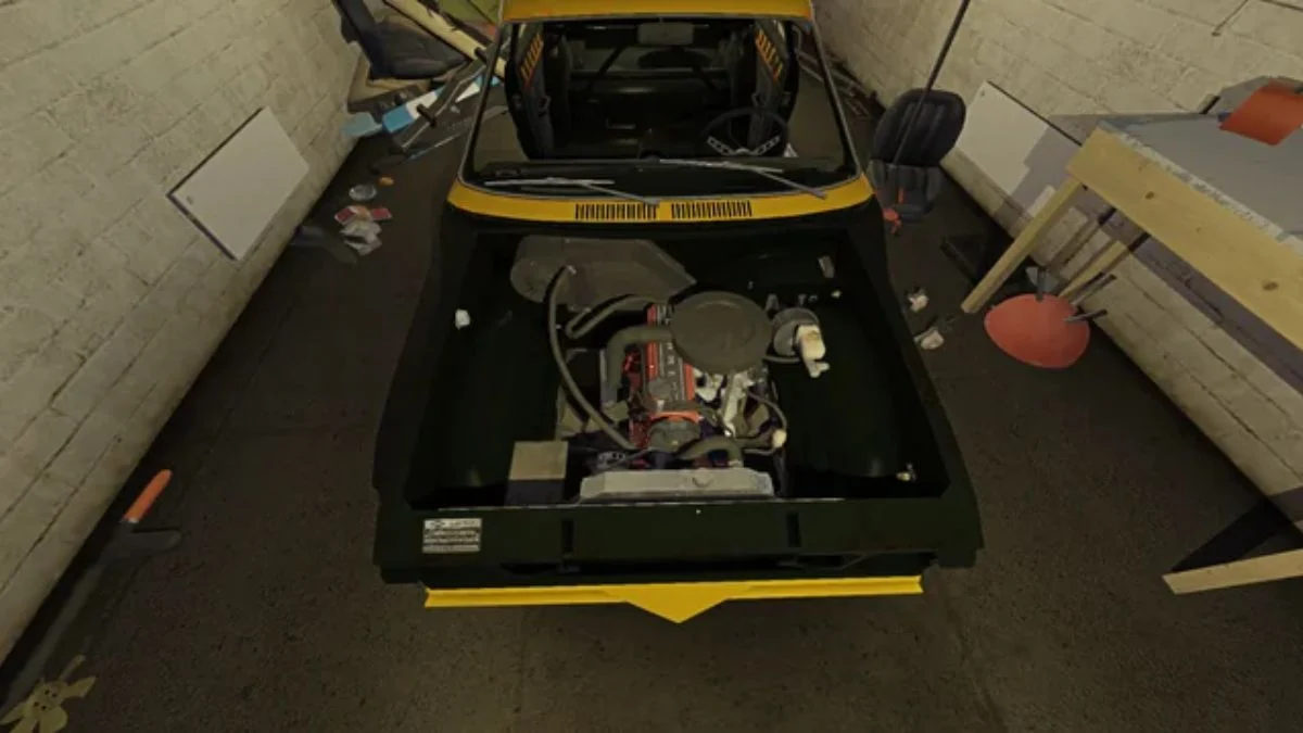 Overhead view of a yellow Satsuma engine bay in My Winter Car showing the brake master cylinder and engine components.