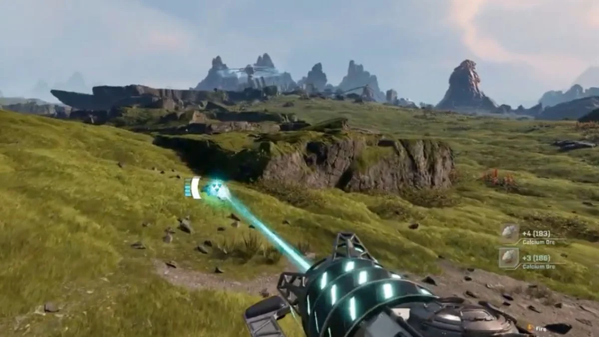 A player using a mining laser to collect small Calcium Ore stones from a grassy hill in StarRupture.