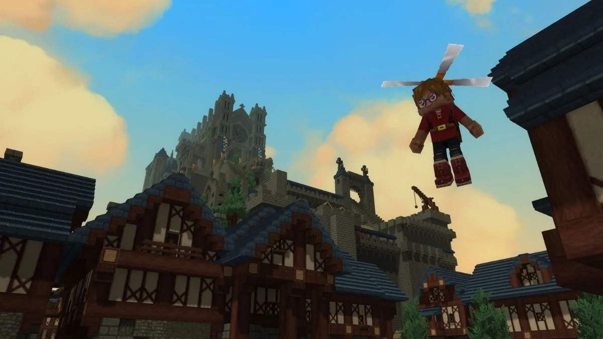 A Hytale character with a propeller hat flying over a detailed medieval town with a large stone cathedral in the background.