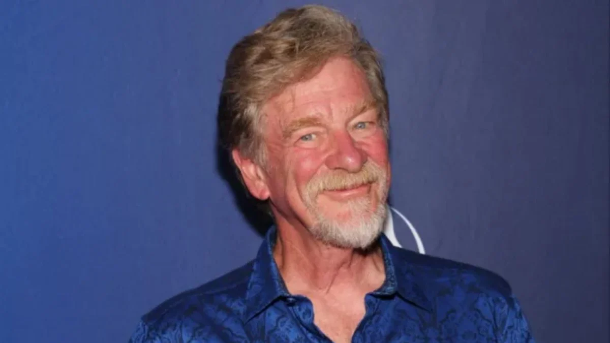Close-up portrait of animator and director Roger Allers in a blue patterned shirt.