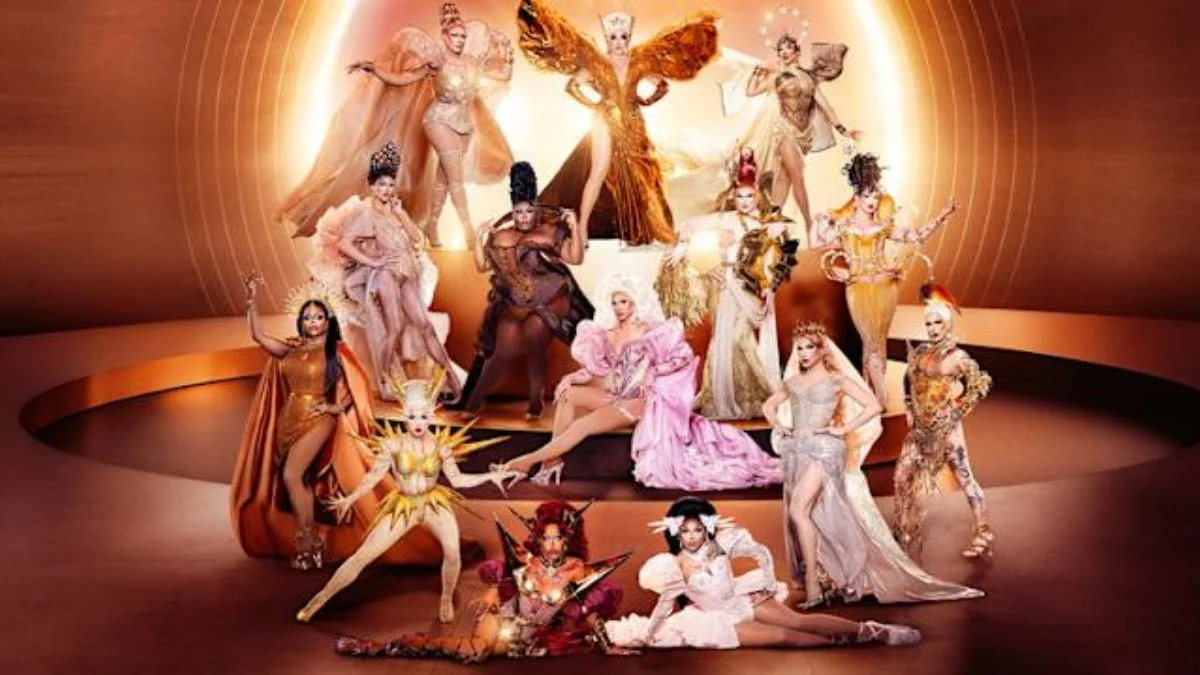 The 14 queens of RuPaul’s Drag Race Season 18 posed together in elaborate golden and metallic runway outfits.
