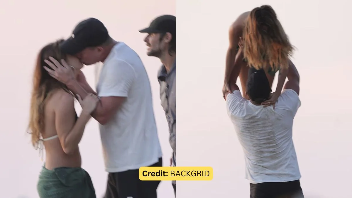 Channing Tatum in a white T-shirt and black cap kissing Inka Williams and lifting her up during a Costa Rica beach vacation.