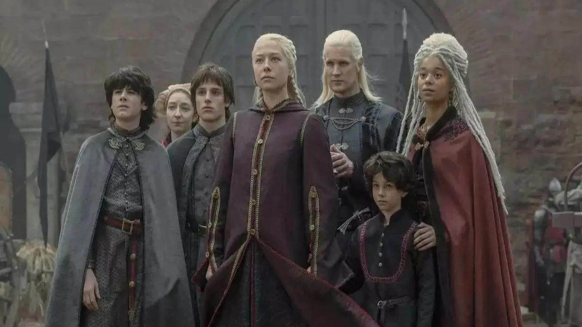 Queen Rhaenyra Targaryen with her family and Team Black supporters standing together.