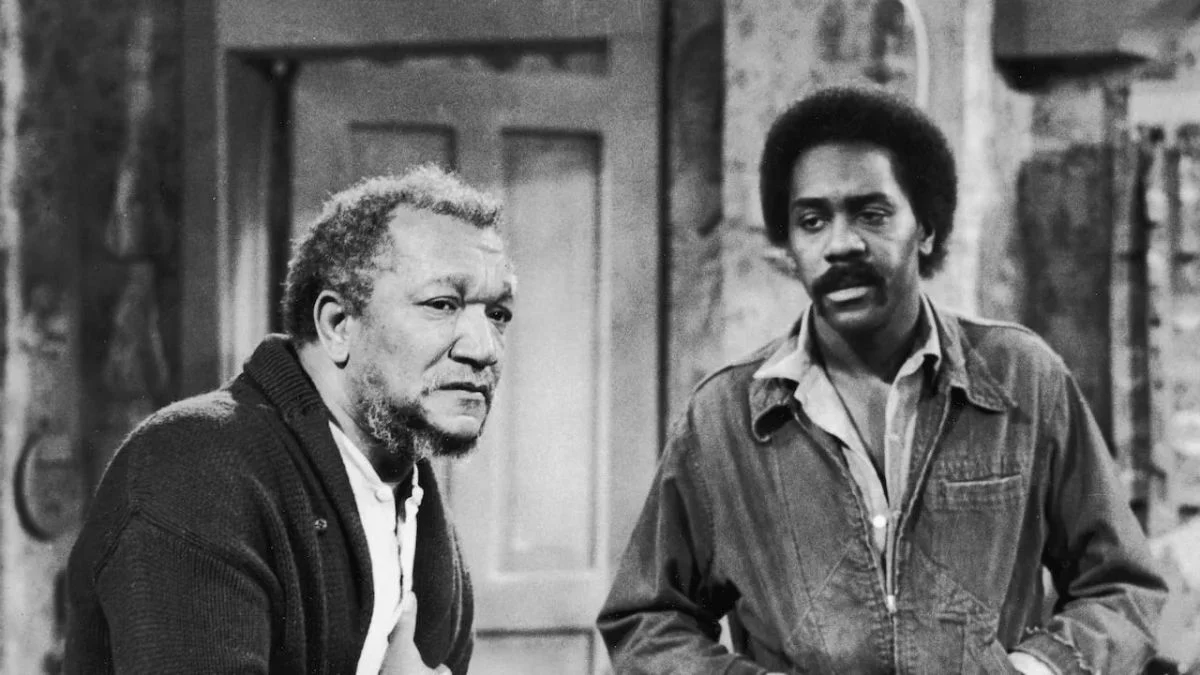 Black and white still of Redd Foxx as Fred Sanford and Demond Wilson as Lamont Sanford from the TV show Sanford and Son.