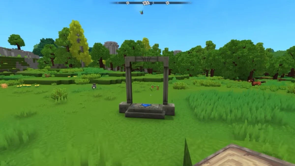 A stone teleporter frame standing in a green grassy field in Hytale.