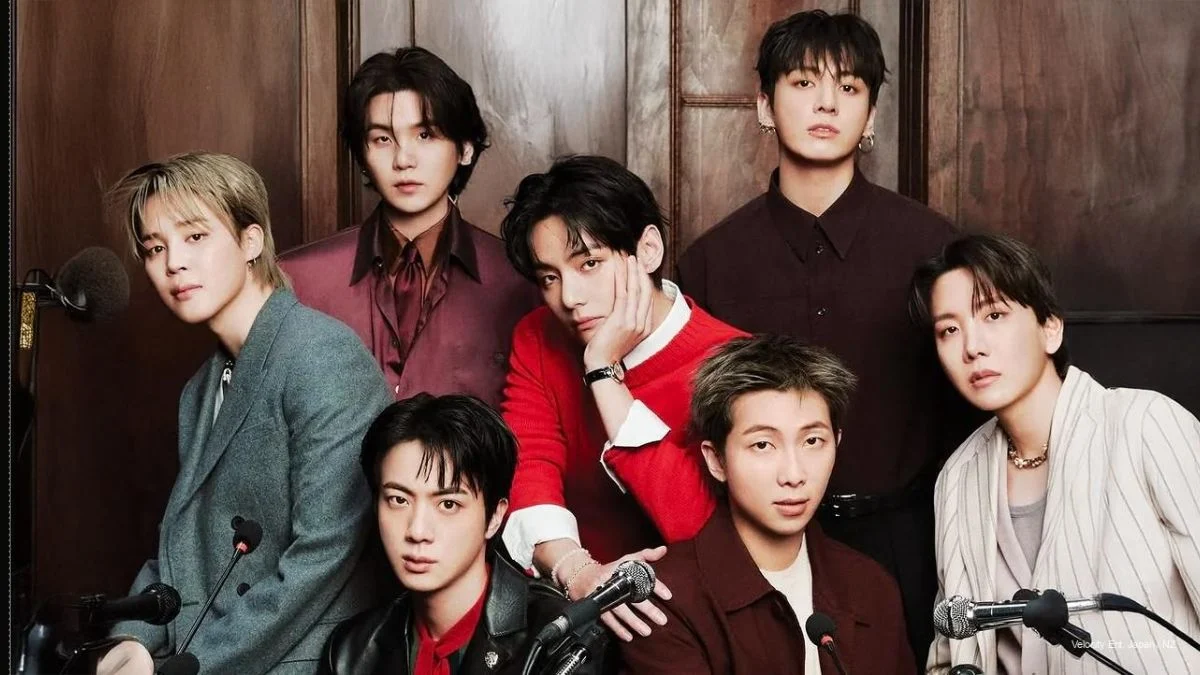 All seven members of BTS—RM, Jin, SUGA, j-hope, Jimin, V, and Jung Kook—posing together for the Arirang World Tour announcement.