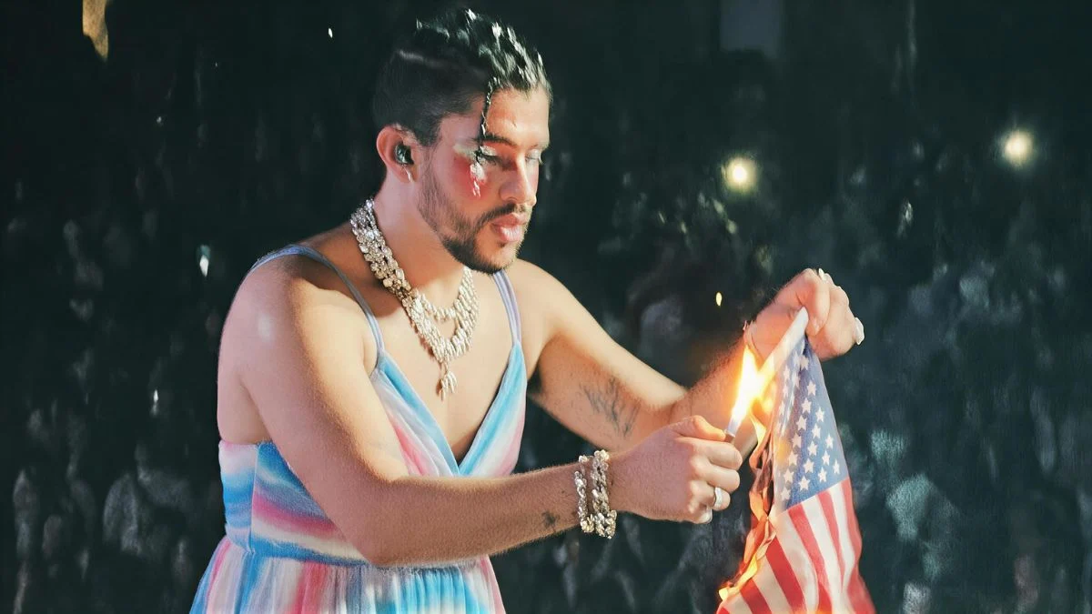 A fake AI-generated image showing Bad Bunny in a striped dress appearing to light an American flag on fire.