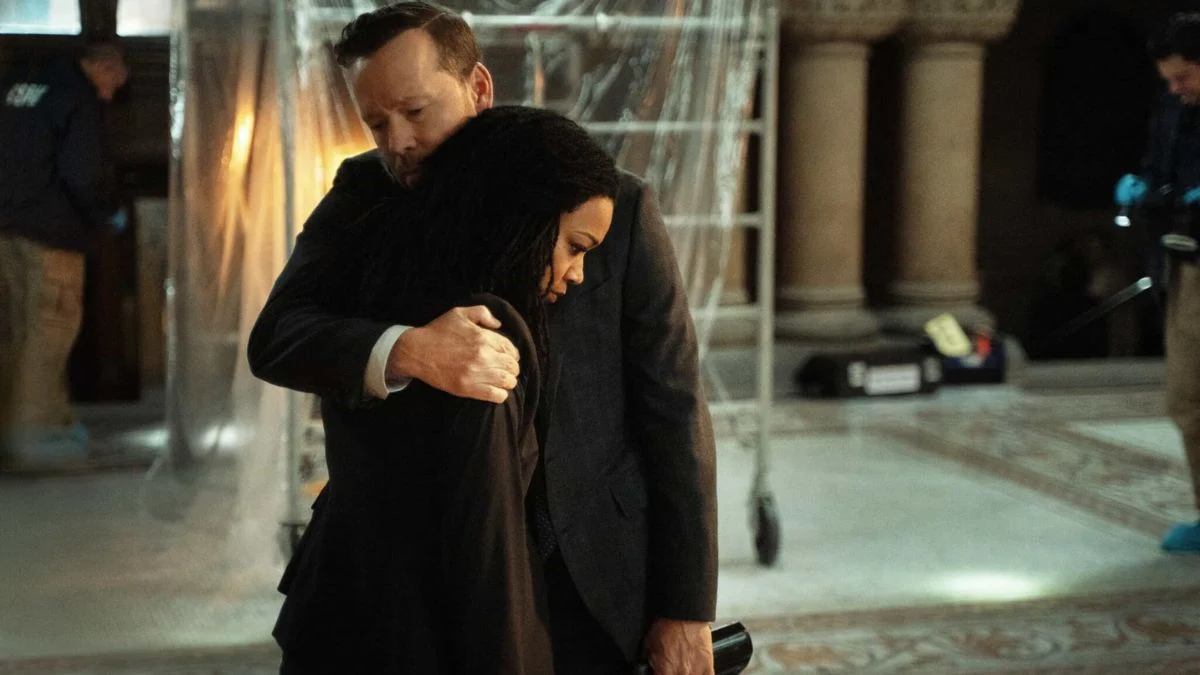 Danny Reagan (Donnie Wahlberg) comforting Lena Silver (Sonequa Martin-Green) at a crime scene in Boston Blue Season 1 Episode 10.
