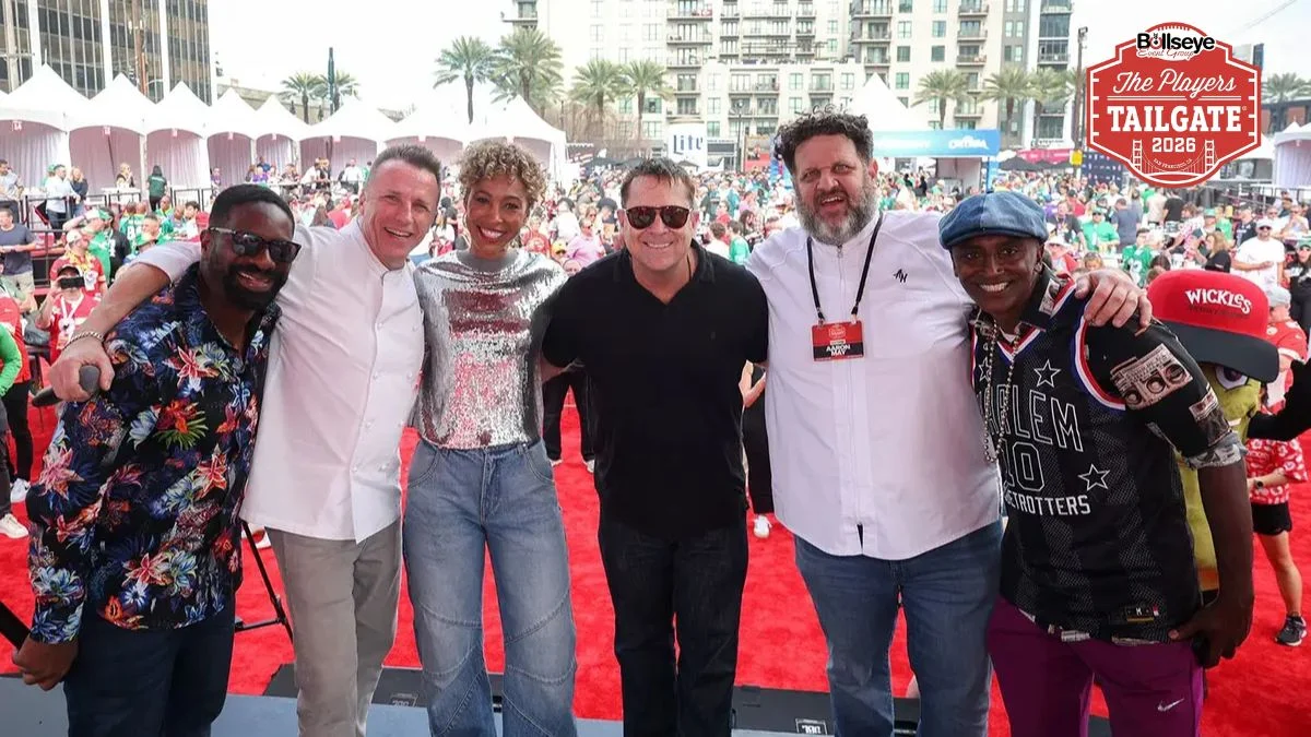 A group of people including celebrity chefs and hosts smiling at the Players Tailgate 2026.