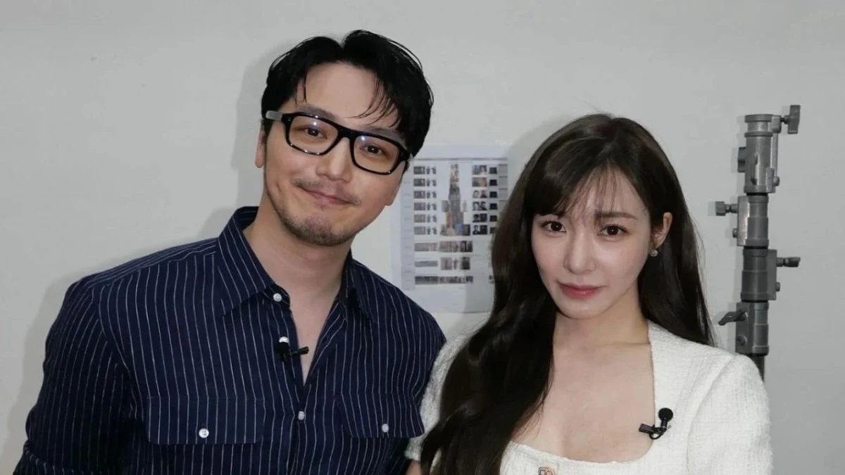 Actor Byun Yo Han in a blue striped shirt and glasses standing next to Girls' Generation's Tiffany Young in a white outfit.