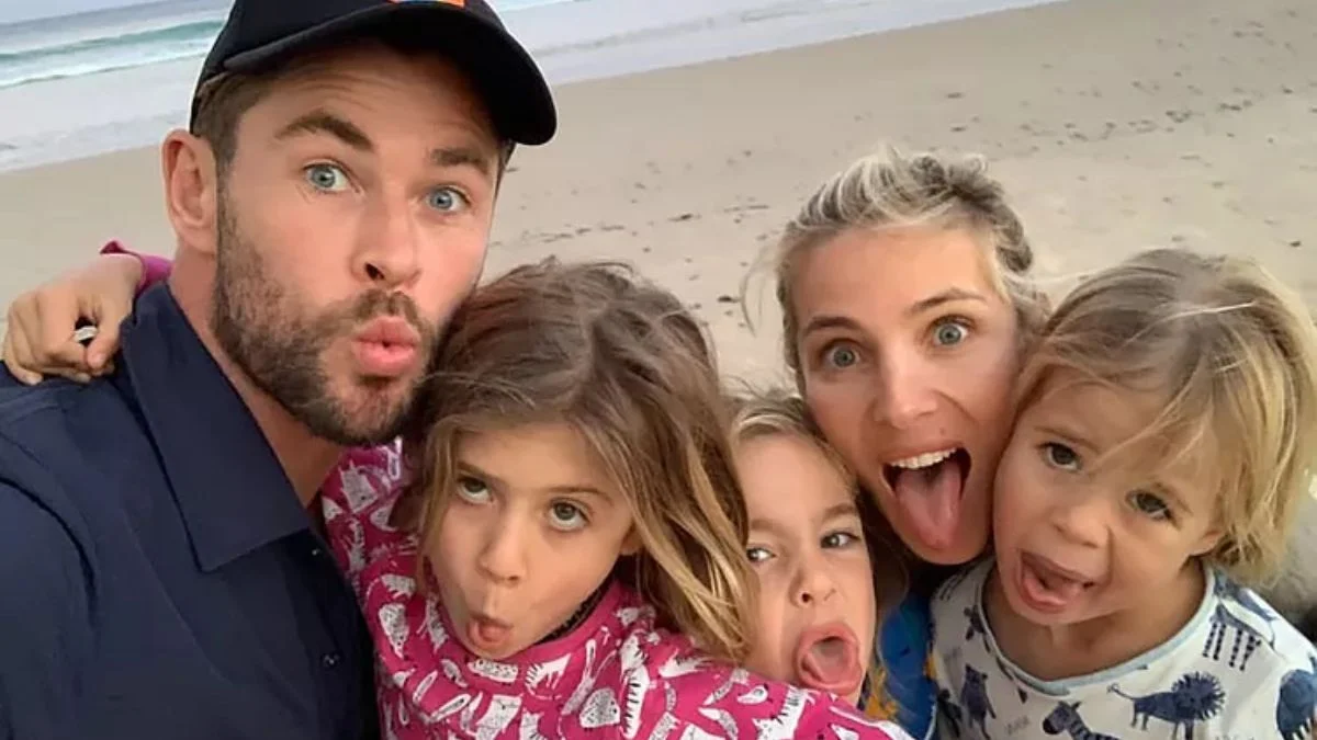 Chris Hemsworth and Elsa Pataky making funny faces with their three children on an Australian beach.
