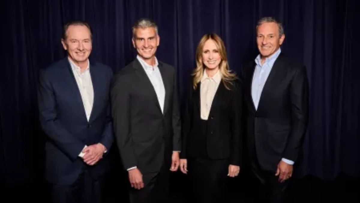 Disney leadership transition group photo featuring incoming CEO Josh D'Amaro, Bob Iger, Dana Walden, and David Muir.