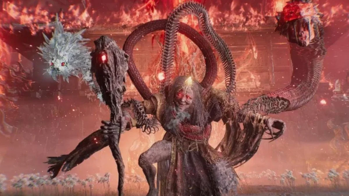 A player battling a multi-headed snake boss in a burning temple in Nioh 3.