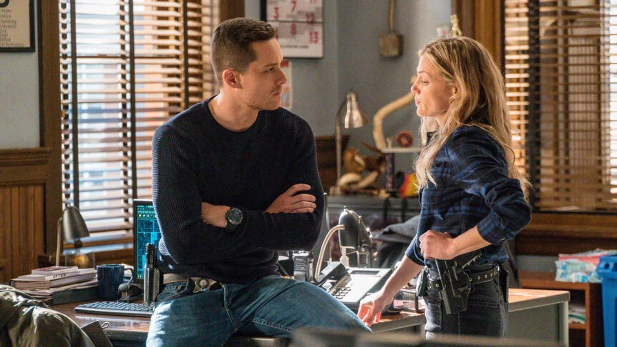 Jay Halstead and Hailey Upton in an intense conversation inside the Intelligence Unit office.