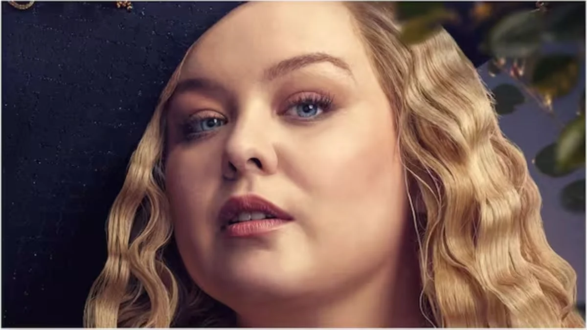 Nicola Coughlan as Penelope Featherington in Bridgerton with a determined expression and blonde wavy hair.