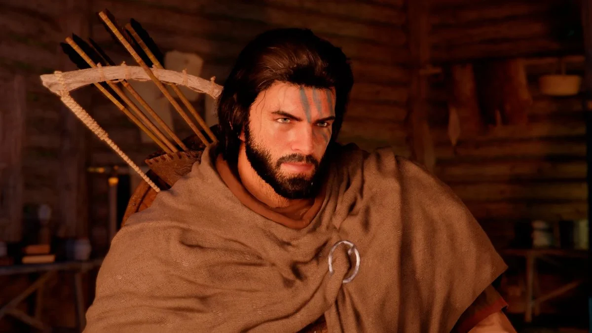 Kliff Macduff, the main protagonist of Crimson Desert, looking forward with blue face paint.