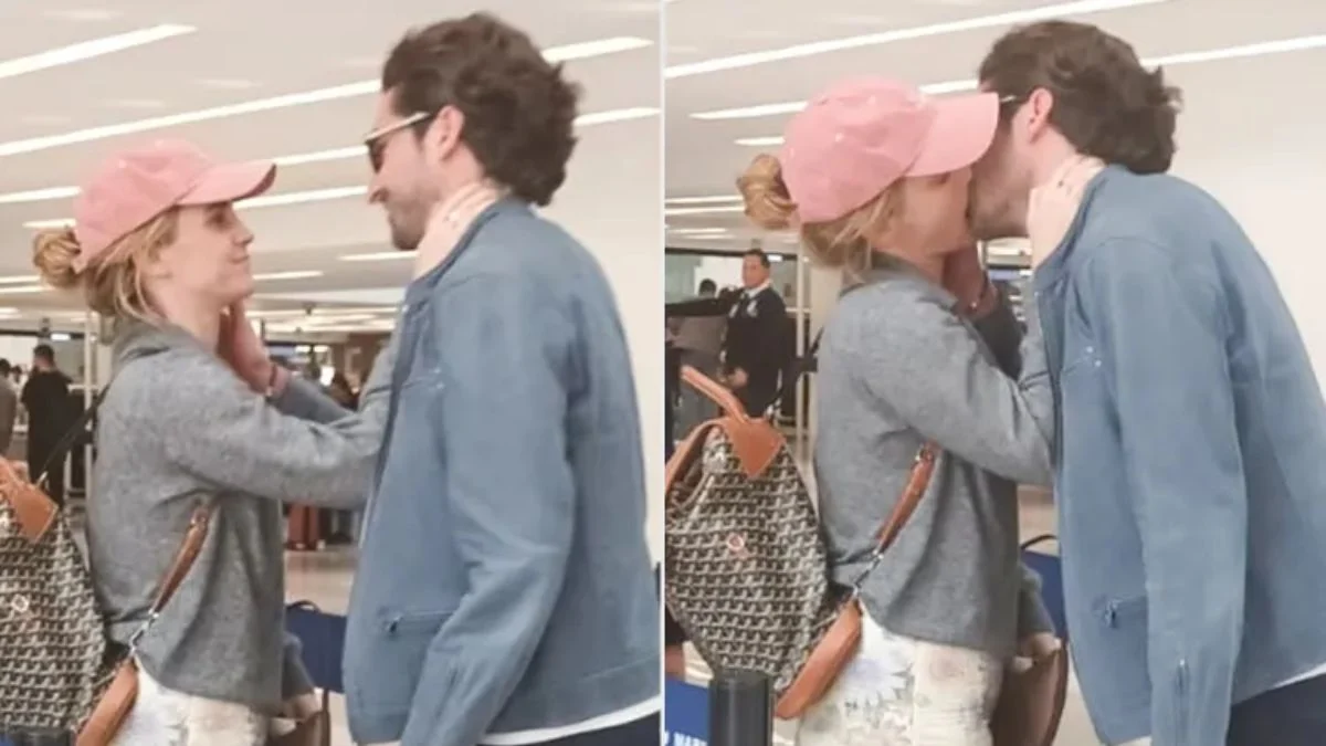 Close-up shots of Emma Watson wearing a pink cap and grey sweater kissing entrepreneur Gonzalo Hevia Baillères at an airport.