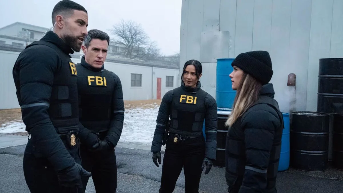 FBI Season 8 cast members OA, Stuart Scola, Eva Ramos, and Maggie Bell standing outside in tactical gear during Episode 12 Daybreak.