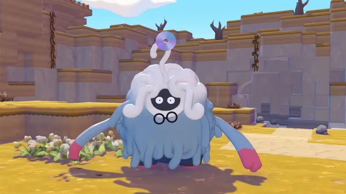 A blue Tangela-like Pokémon with white hair and a CD on its head in Pokémon Pokopia.