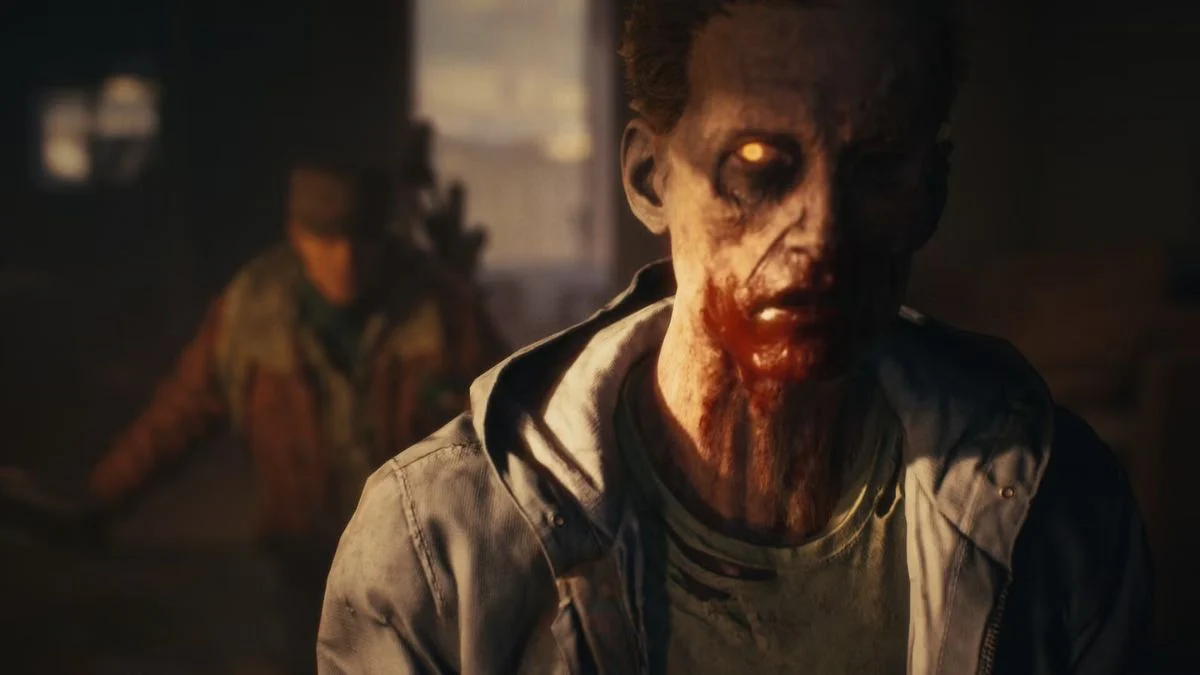 A close-up of a glowing-eyed zombie in State of Decay 3 with a survivor blurred in the background.