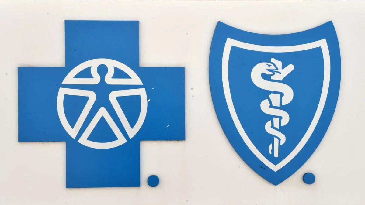 Blue Cross Blue Shield logos of a cross and a shield representing the health insurance antitrust settlement.