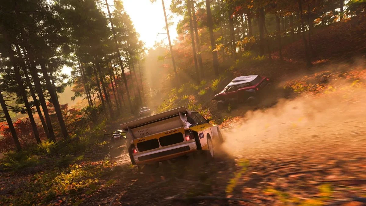 A group of rally cars, including an Audi Quattro, racing through a sun-drenched forest in Forza Horizon 6.
