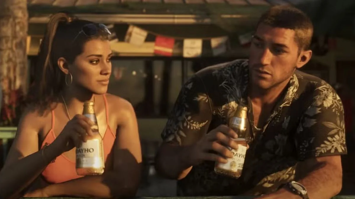 Grand Theft Auto VI protagonists Lucia and Jason sitting at an outdoor bar holding bottles of beer.