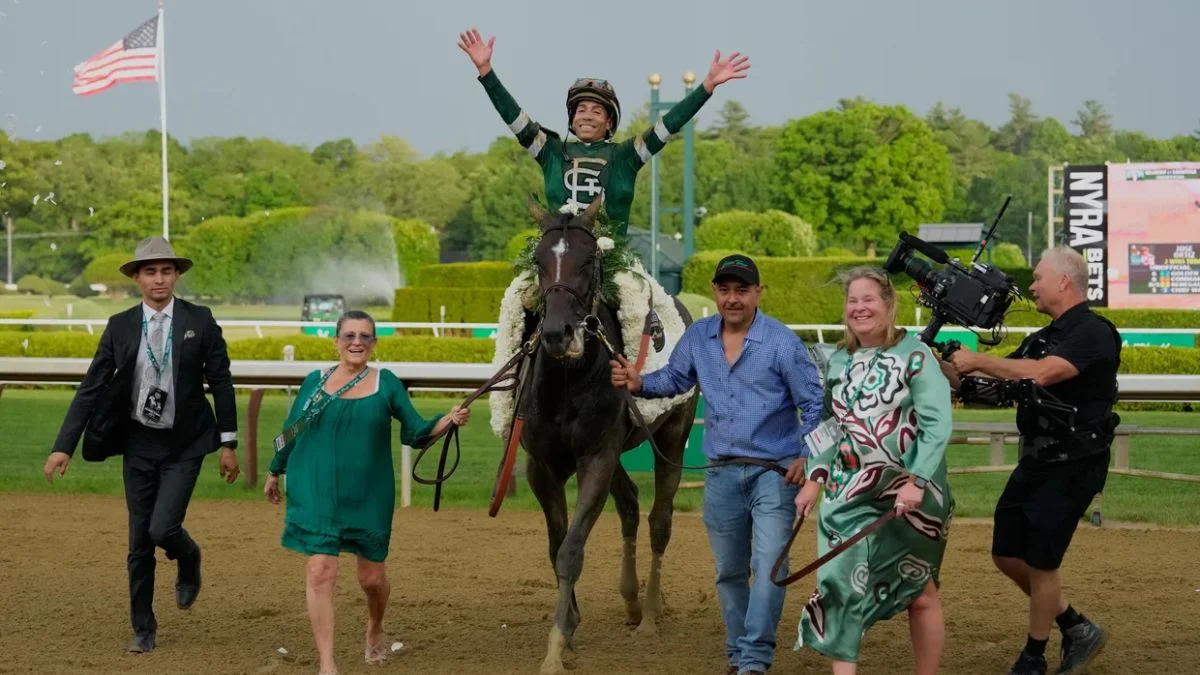 Golden Tempo crossing the finish line with jockey Jose Ortiz to win the 2026 Belmont Stakes at Saratoga Race Course.