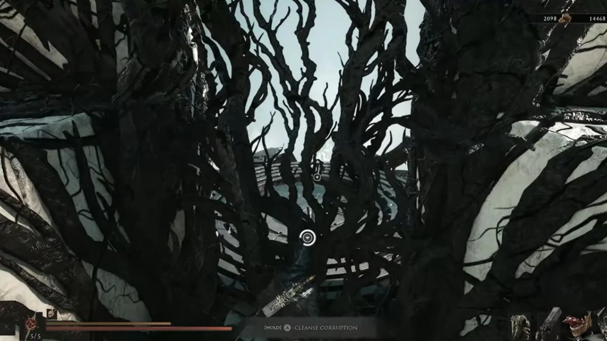 Player cleansing corruption near dark overgrown vines along the Axatana route in Mortal Shell 2.