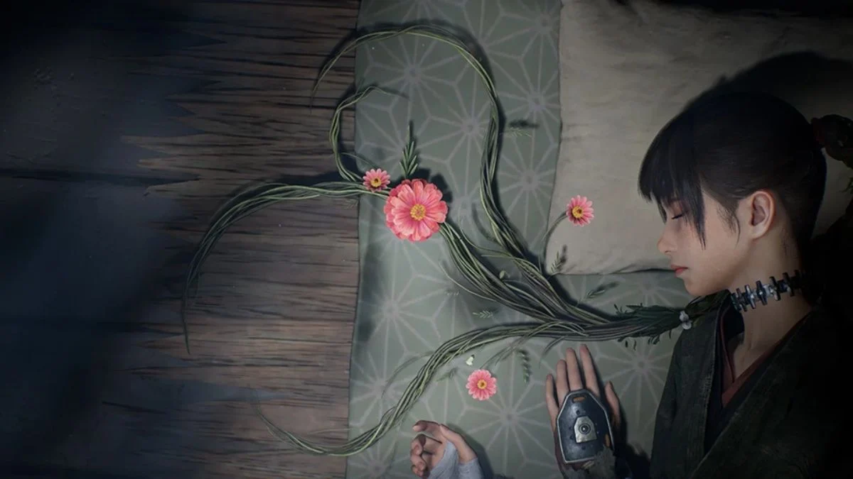 Overhead close-up of Emma resting on a futon with pink floral vines extending from her hair in Beast of Reincarnation.
