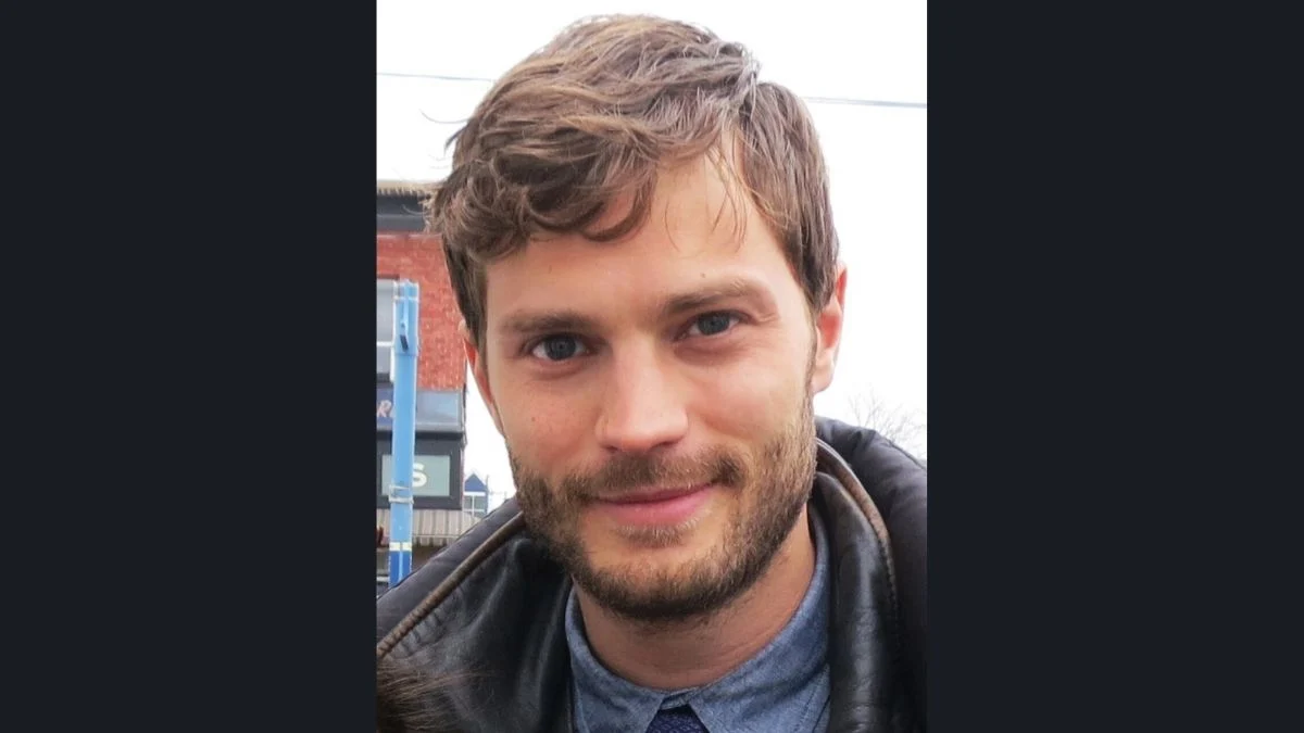 Close-up portrait of actor Jamie Dornan outdoors