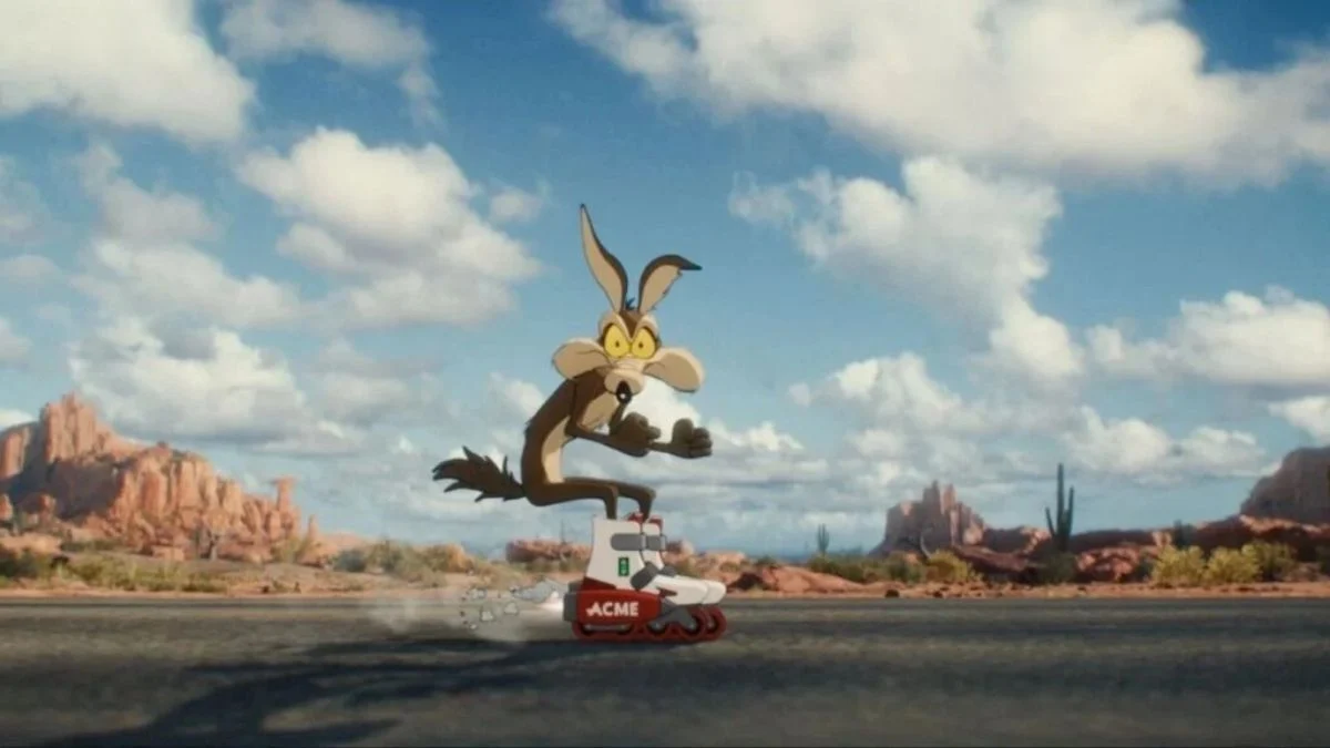 Wile E. Coyote riding rocket-powered Acme roller skates on a desert road in Coyote vs. Acme.