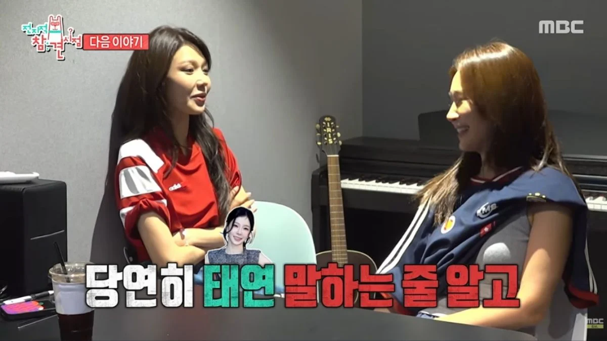 Girls' Generation members Sooyoung and Hyoyeon sitting across from each other talking during a recording studio scene on MBC's The Manager.