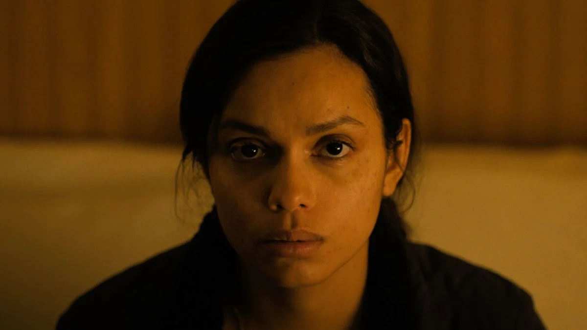 State Trooper Jane Archer staring ahead blankly with a traumatized expression in the final scene of Psycho Killer 2026.