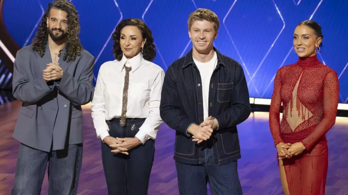 Judges Mark Ballas, Shirley Ballas, host Robert Irwin, and judge Jenna Johnson posing in the ballroom during DWTS: The Next Pro Episode 4.