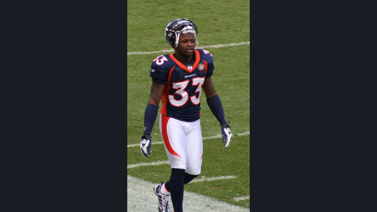 Alphonso Smith Jr. wearing Denver Broncos jersey number 37 on the football field