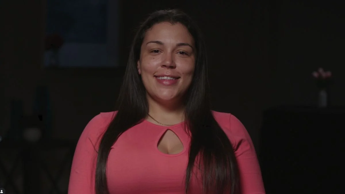 Love After Lockup star Amber Eggers smiling during a WE tv interview segment.