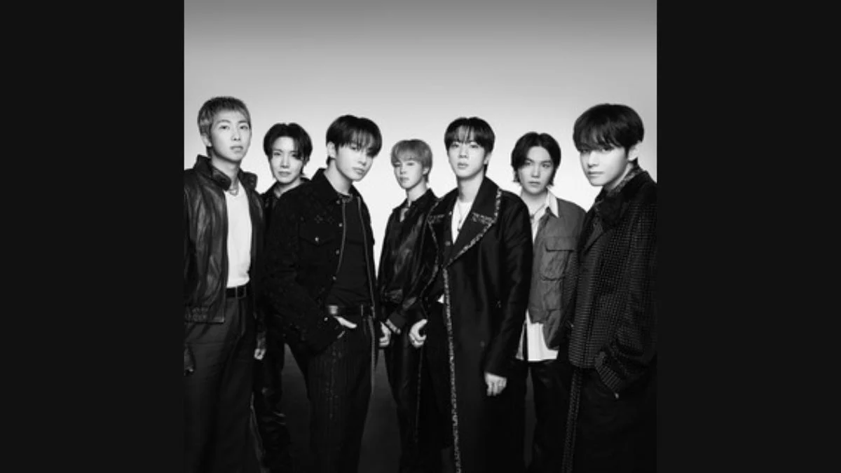 Black and white promotional photo of all seven BTS members posing together for their 2026 iHeartRadio Music Festival appearance