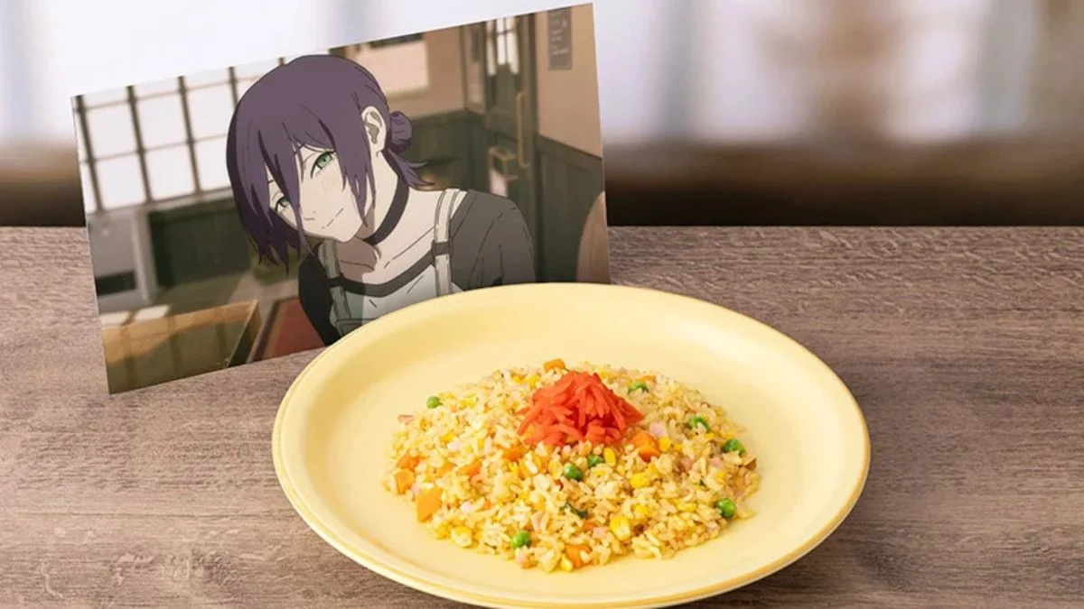 A plate of Cafe Nido's Fried Rice topped with pickled ginger next to a printed picture of Reze from Chainsaw Man.