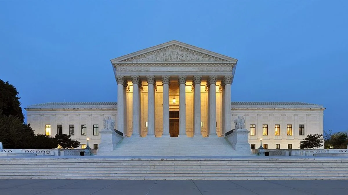 Exterior front view of the United States Supreme Court building at dusk