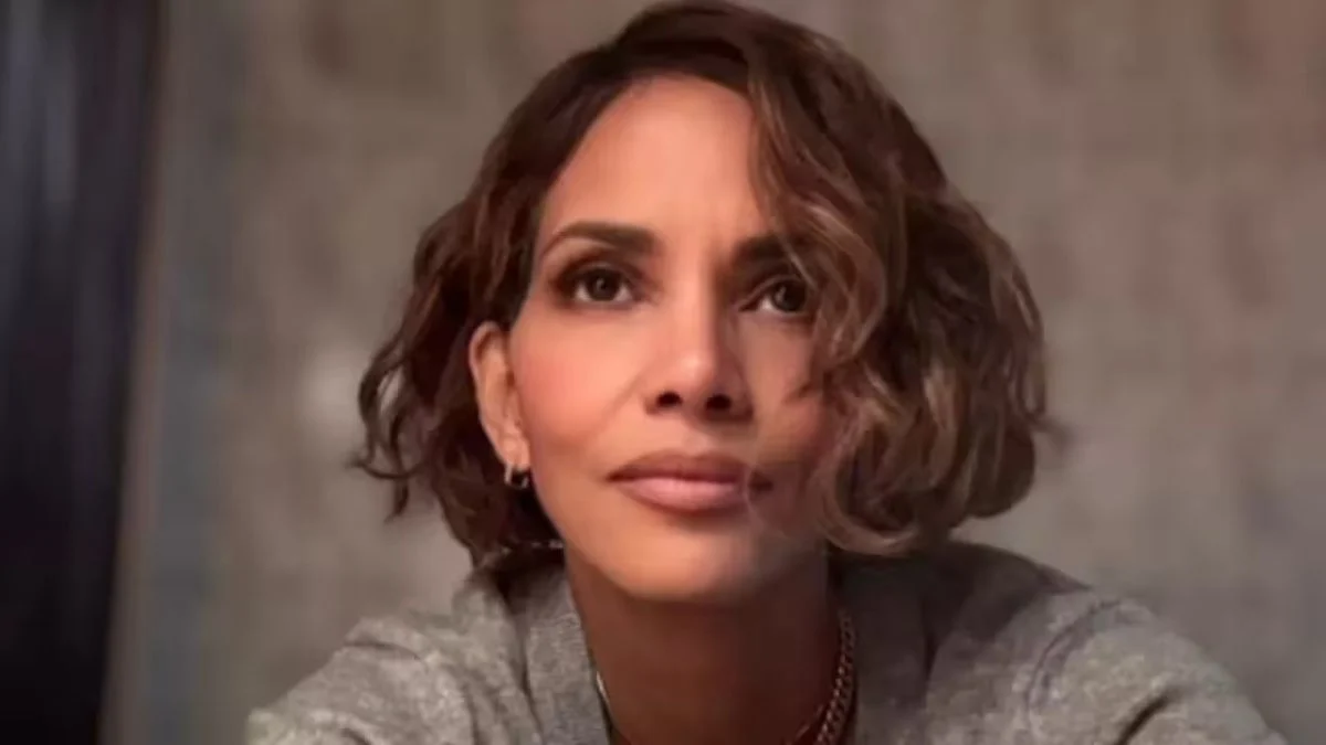 Halle Berry smiling warmly while looking slightly off-camera.